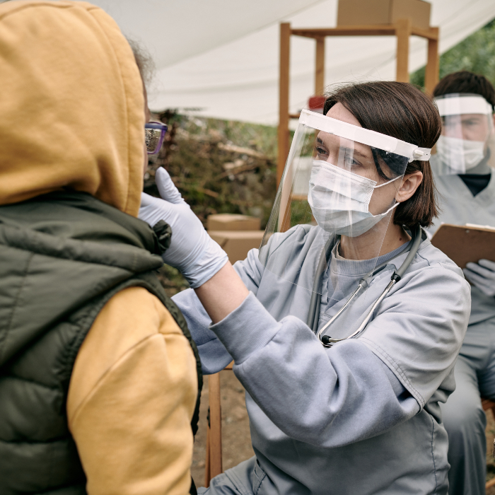 doctor treating migrants
