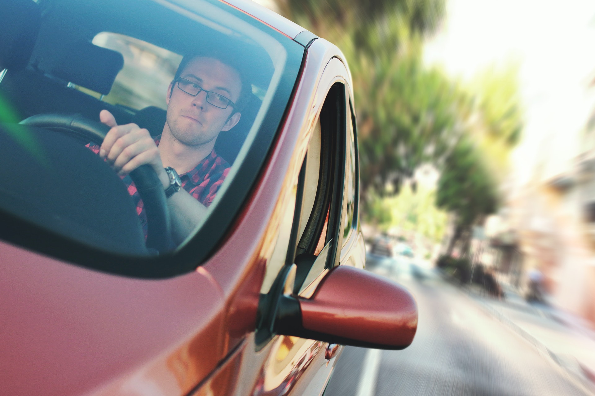 man driving a car