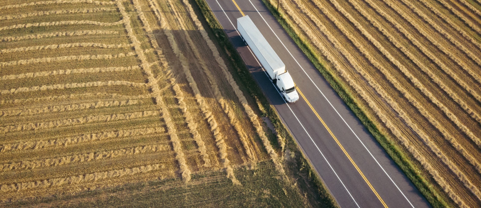 Farm with a large cargo truck on the road