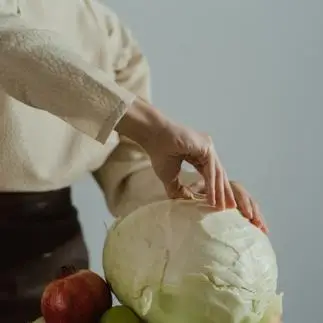 woman peeling vegetables