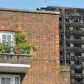 grenfell tower building behind pretty balcony