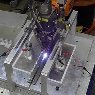 Ultrasonic assisted laser welding for automotive battery packs