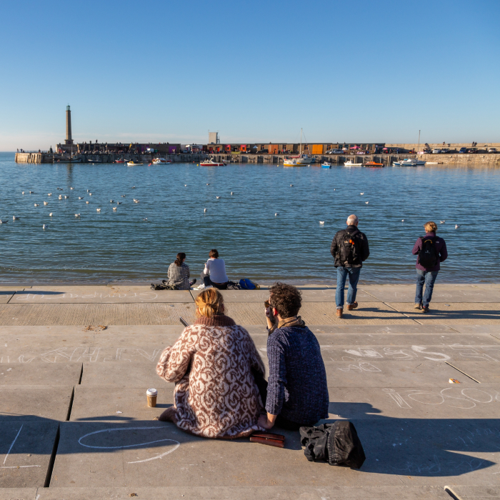 people sitting and looking out to margate promenade