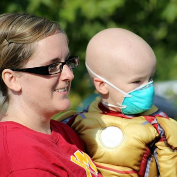 mother holding a sick child