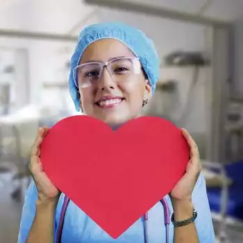 nurse holding a heart