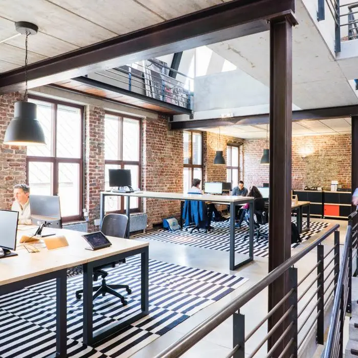 Office with desks and people working on computers