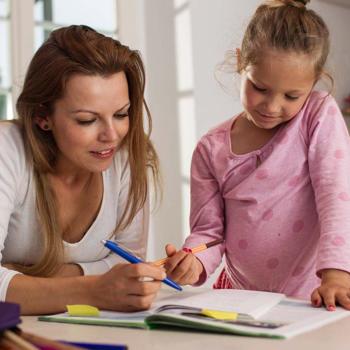 mother with daughter doing homework