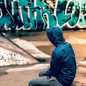 boy sitting in skate park