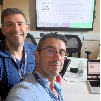 Ivan Girina and Alessandro Valerio Tridico in a PLAY+ workshop taking a selfie