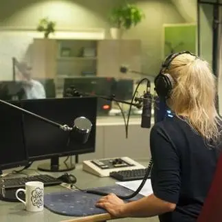 woman presenter in a radio station