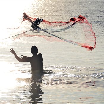 man fishing in ocean
