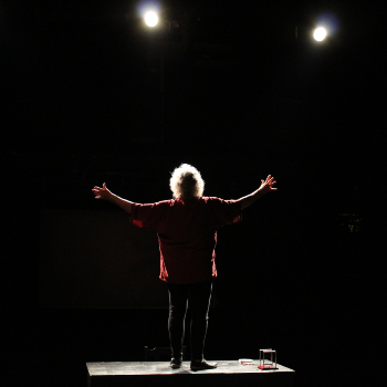 A man standing while spreading his hand