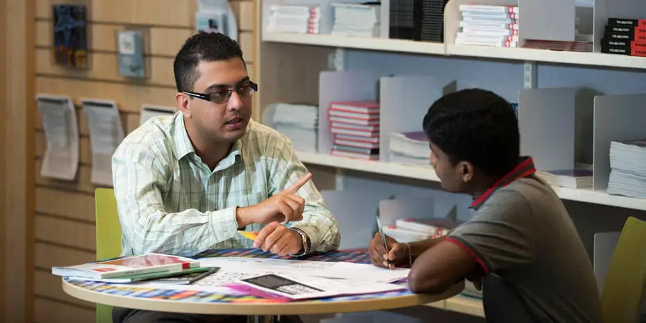 campus adviser talking to student