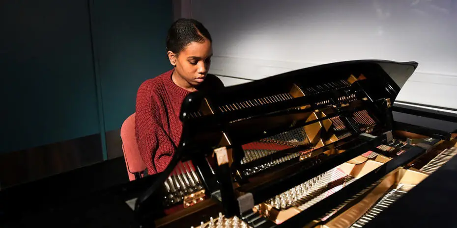 Brunel student playing the piano