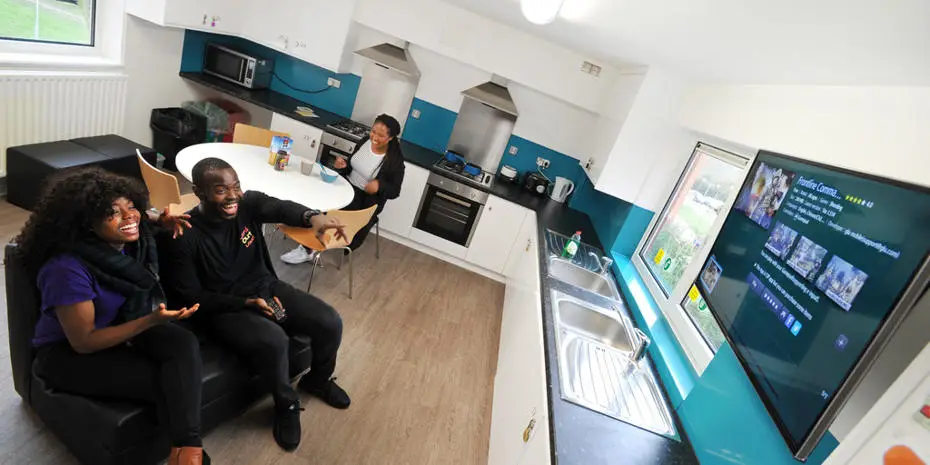 Students watching television in their accommodation at Brunel University London.
