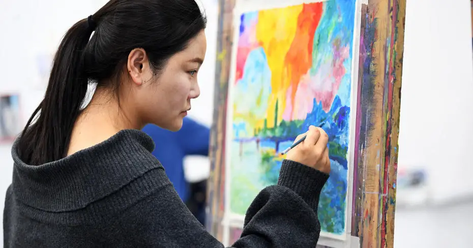 Female student painting in the art centre