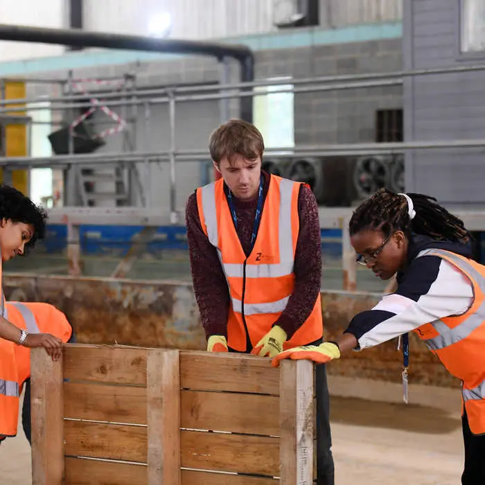 Students inspecting flood defence