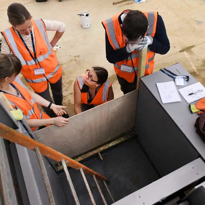 Students inspecting flood defence
