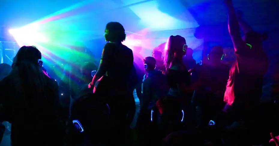 Students dancing in nightclub on campus