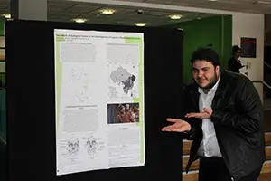 Student explaining poster presentation