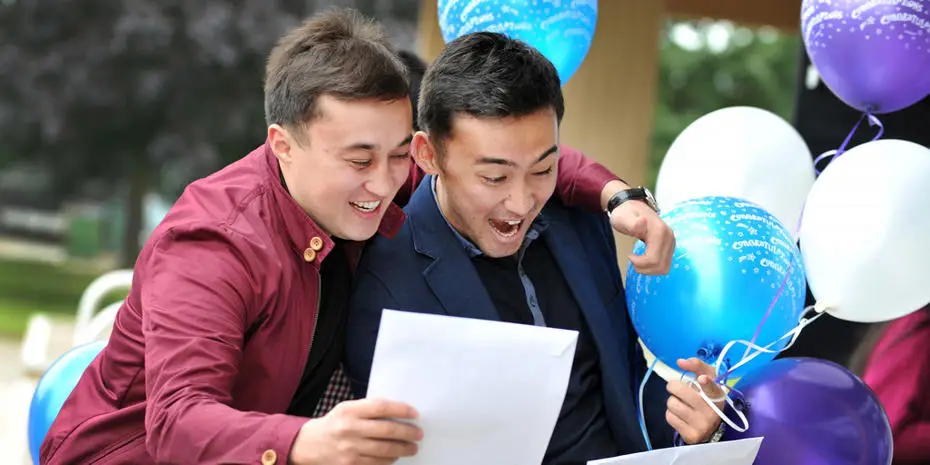two men happy with certificate