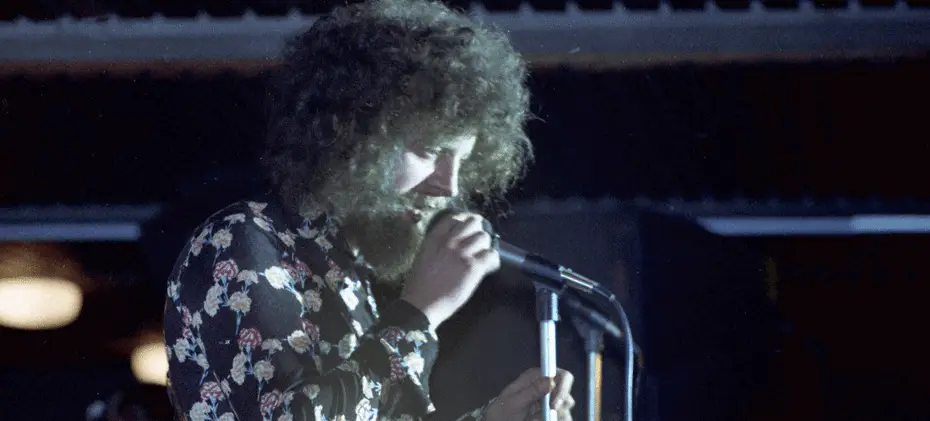 ELO singer on stage and singing into a microphone