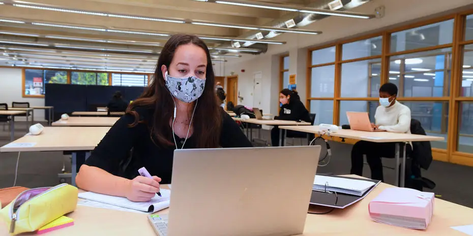 Brunel student studying in the Library