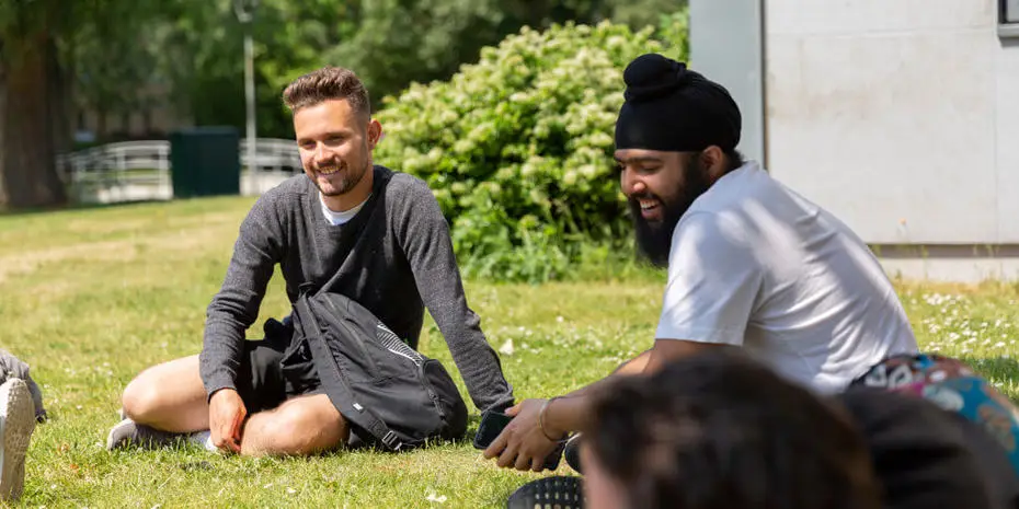 students chatting in Brunel park