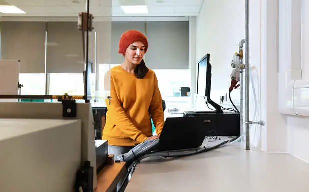 Nokhaiz Sabir on laptop