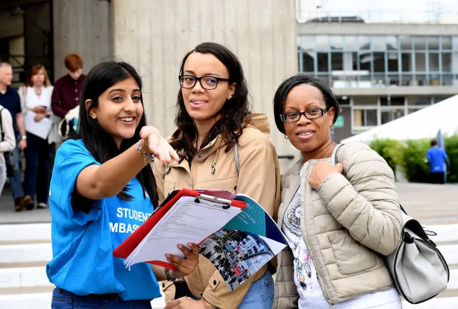 student ambassador directing guests on open day