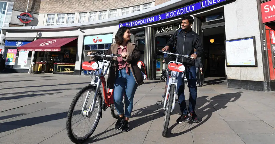 Students using Santander bikes in Uxbridge.