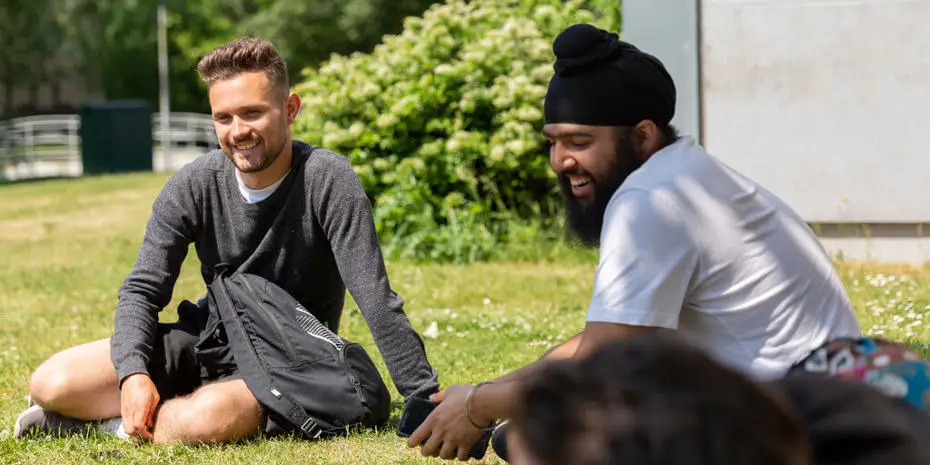 students chatting in Brunel park