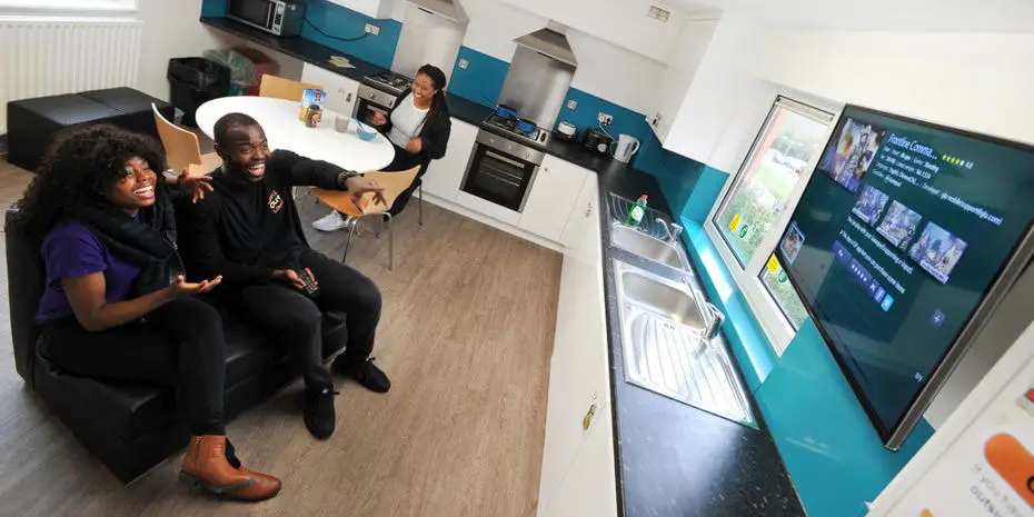 students watching TV in Faraday kitchen