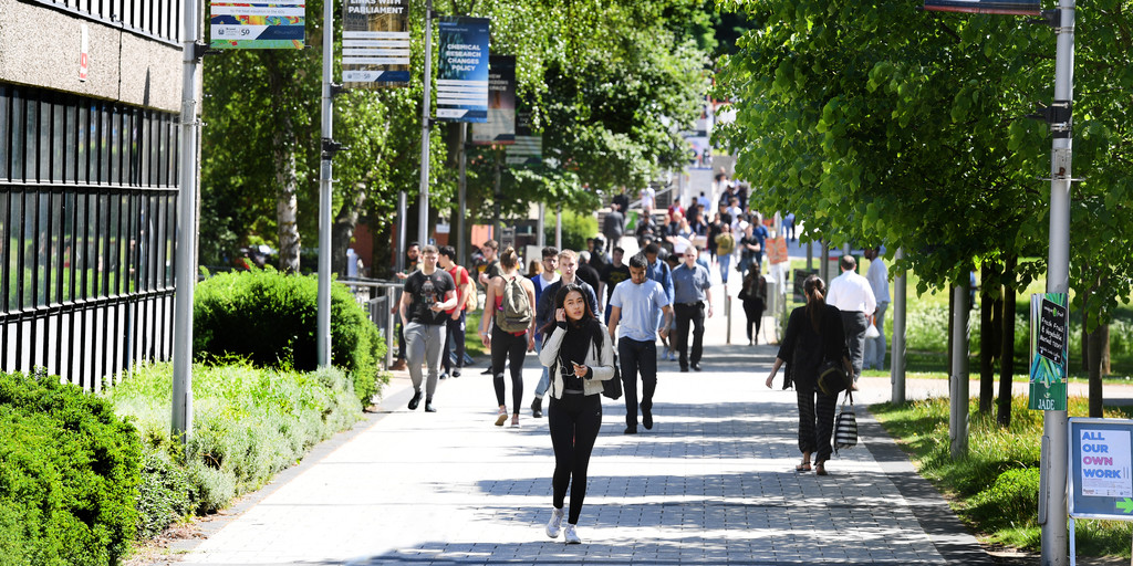 Students walking around Brunel campus. 