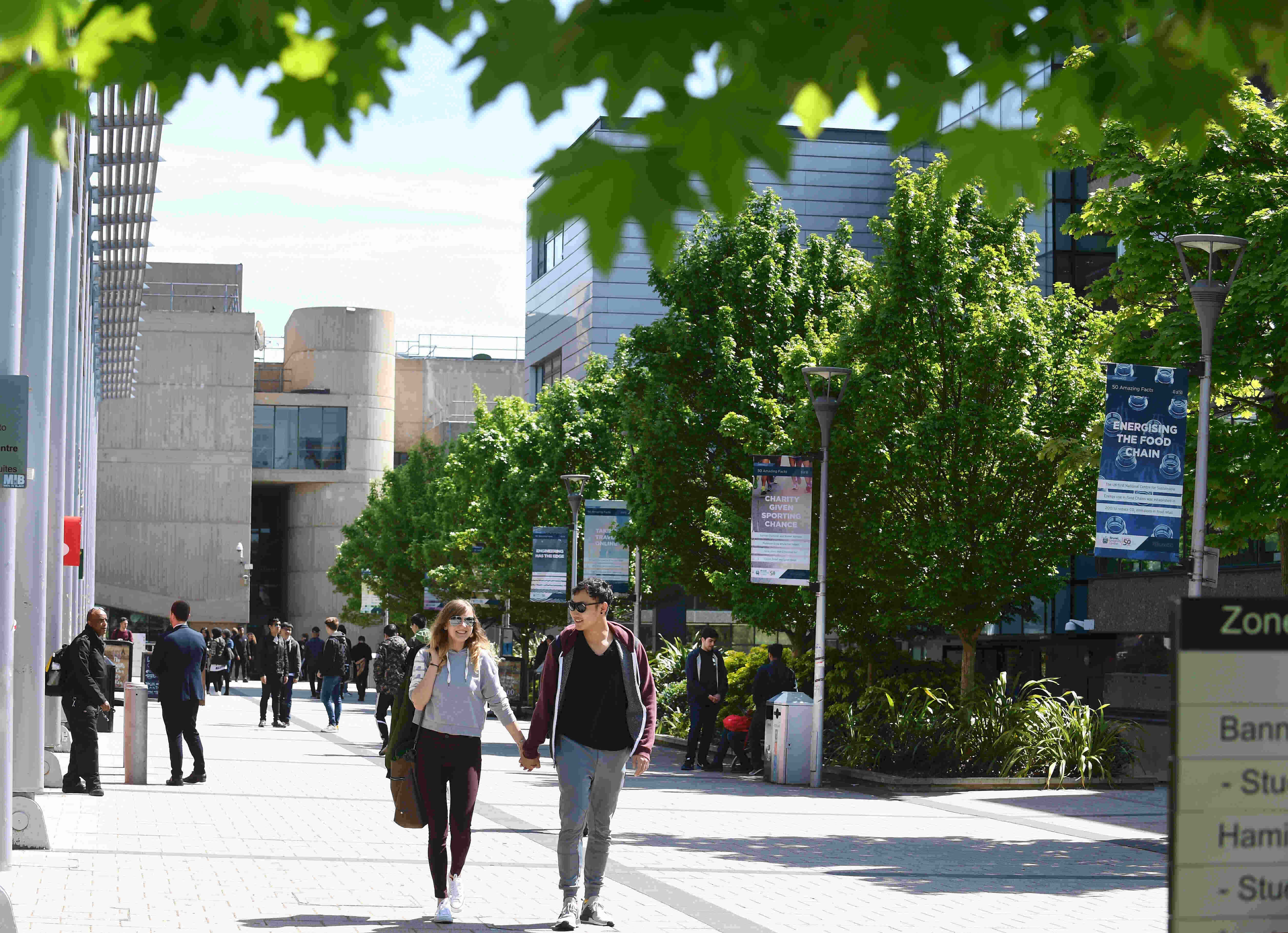 Two students walking on campus