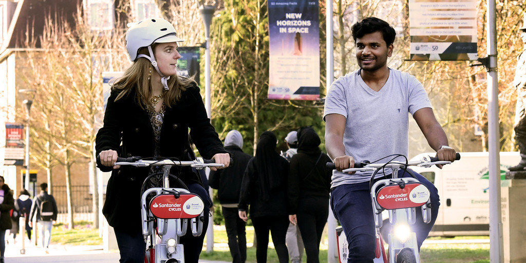 students on Santander Bikes on Brunel campus