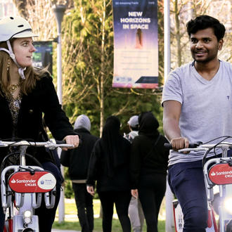students on Santander Bikes on Brunel campus