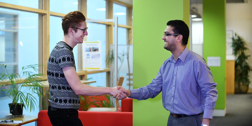 two men shaking hand