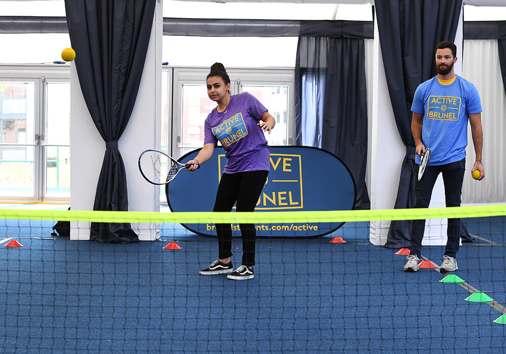 students playing indoor tennis