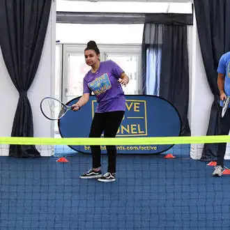students playing indoor tennis