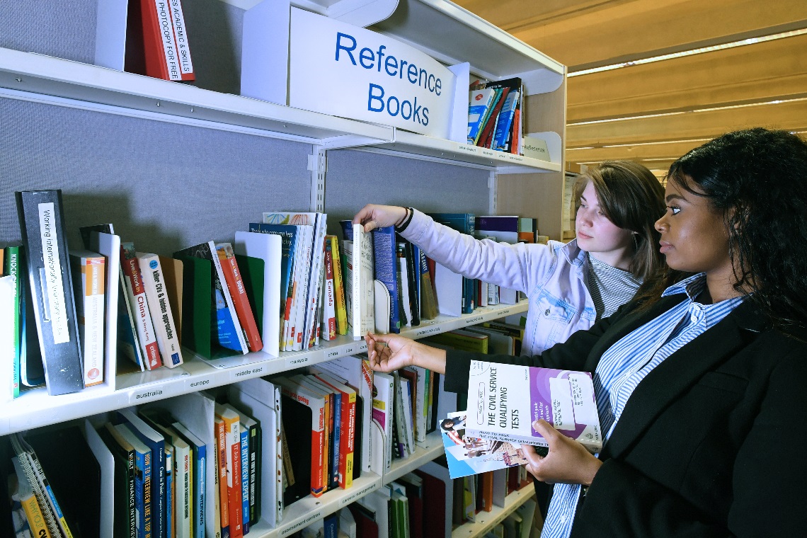 image of two students in library