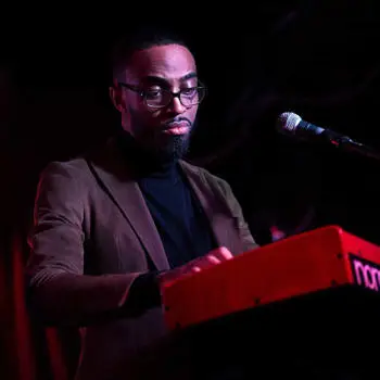 speaker on podium with a microphone ahead of him