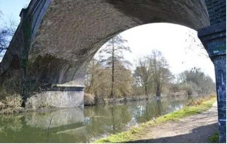 View of the path and canal underneath the bridge