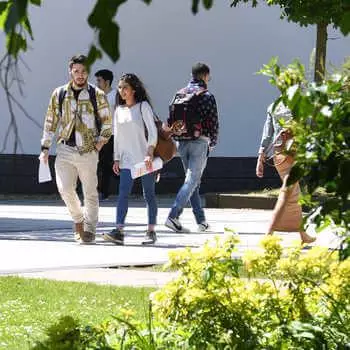 International students walking across Brunel campus