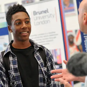 Prospective student talking to a academic at Brunel University Open Day