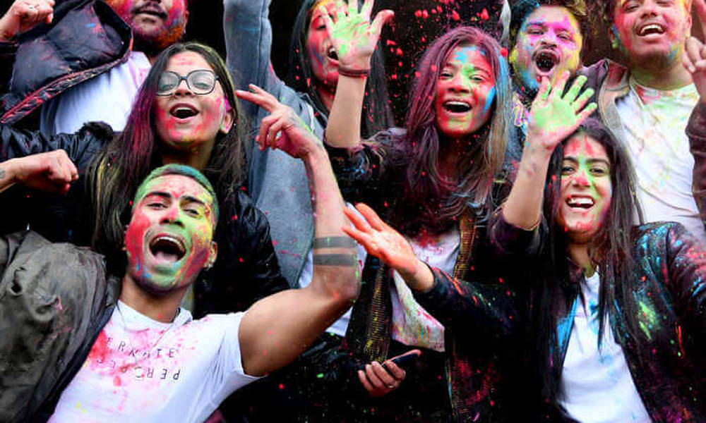 group of students celebrating holi