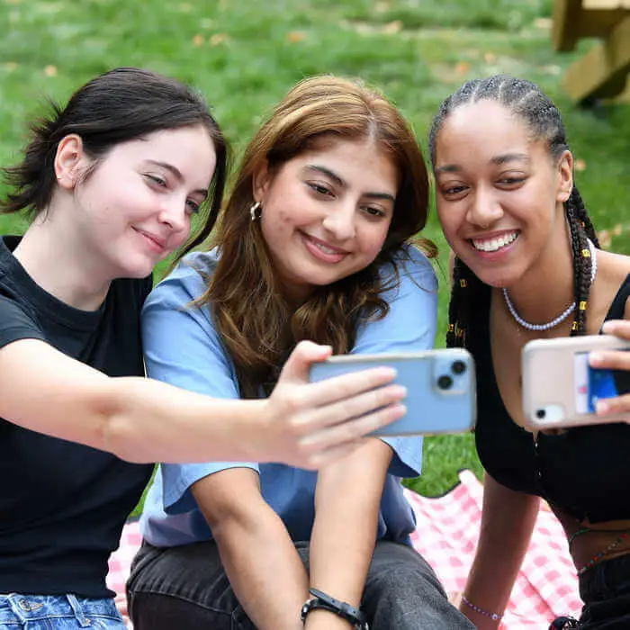 three students taking a selfie