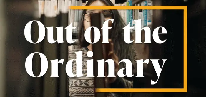 A person stands in a library, partially obscured by books, with bold text Out of the Ordinary framed in yellow