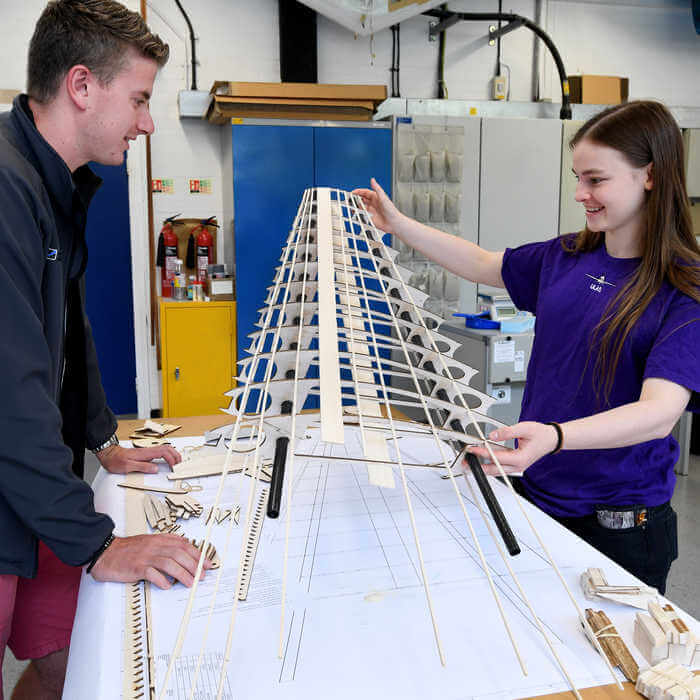 Brunel Aerospace Engineering students working on a empennage model in the engineering lab