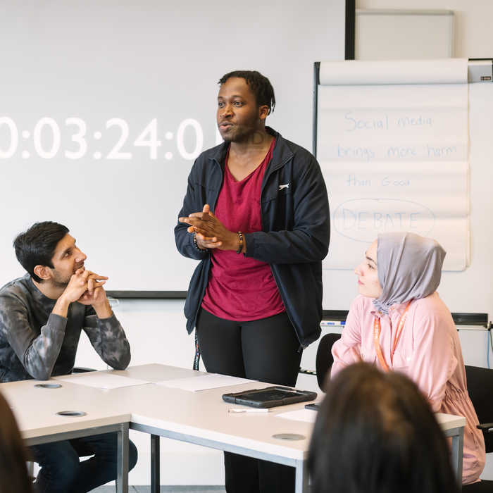 Politics and international relations students debating in the classroom